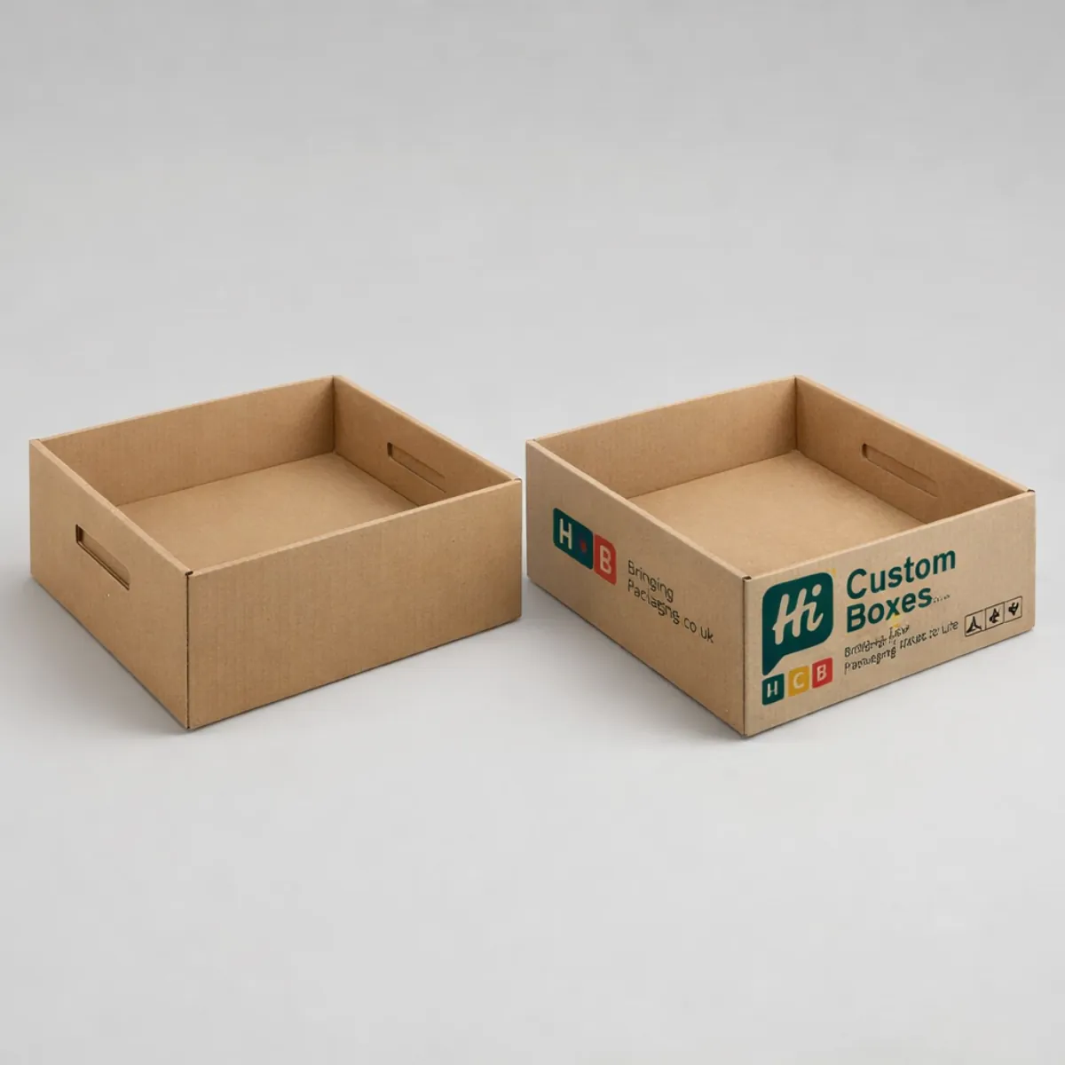 Realistic 3D rendering of open white and branded black cardboard tuck-top hard drive boxes. class=